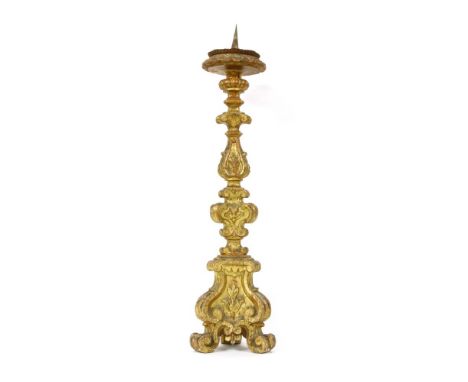 A carved gilt wood pricket candlestick, in the Baroque style, 80cm long