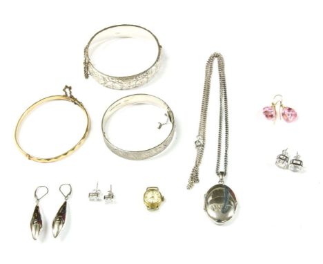 A collection of costume jewellery, to include a sterling silver hollow hinge bangle, engraved floral design to top and bottom