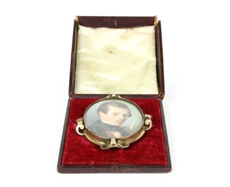 An early 19th century portrait miniature, depicting a gentleman on ivory, signed in red, with gilt metal frame, cased, height