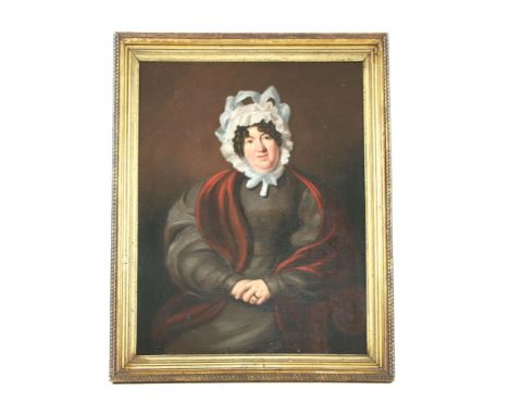 English School, in mid 19th century stylePORTRAIT OF A WOMAN, HALF LENGTH SEATED, IN A GREY DRESS AND WHITE LACE BONNETOil on