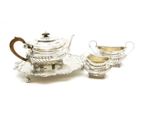 A late 19th century four piece silver tea service, comprising teapot, sugar bowl, cream jug and tray, by Charles Stuart Harri