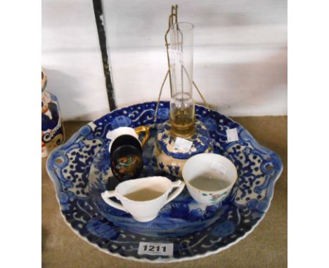 A large early 20th Century Japanese dish with hand painted blue and white floral decoration - sold with a small willow patter