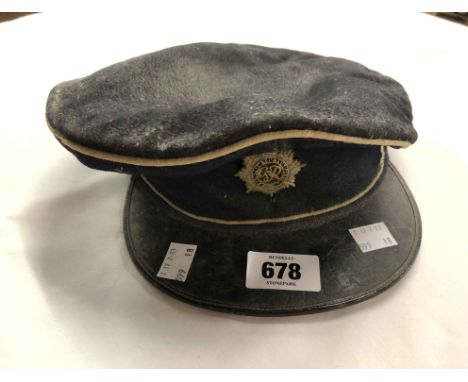 An old army officer's cap with badge for The Royal Army Service Corps