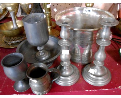 A small selection of pewter items including candlesticks, bowl, goblets and measures - sold with a silver plated wine cooler