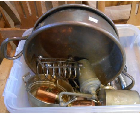 A crate containing a quantity of assorted copper and brassware including Eastern coffee grinder, copper preserving pan, etc.