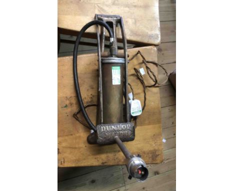 An old Dunlop foot pump upcycled for use as a table lamp