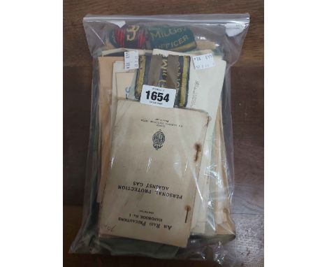 A small collection of military ephemera including ' Arras After The Bombardment' Artistic Album, 2nd World War period and lat