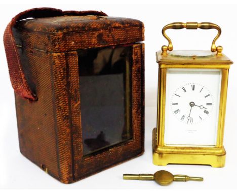 A late 19th Century brass and bevelled glass cased carriage clock with French eight day bell striking strike/repeat movement,