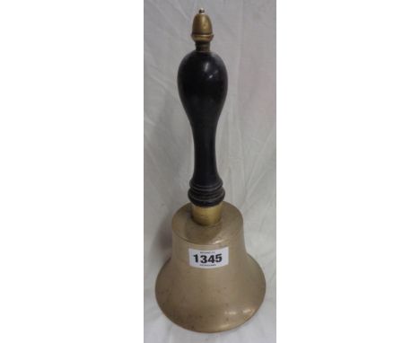 An old brass school style bell with turned ebonised wood handle and acorn finial