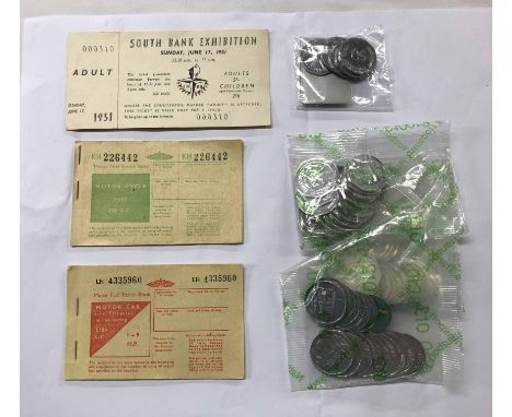 A bag containing a quantity of transport tokens, old Guernsey Post Office 10p stamps, a 1950's motor car fuel ration book and