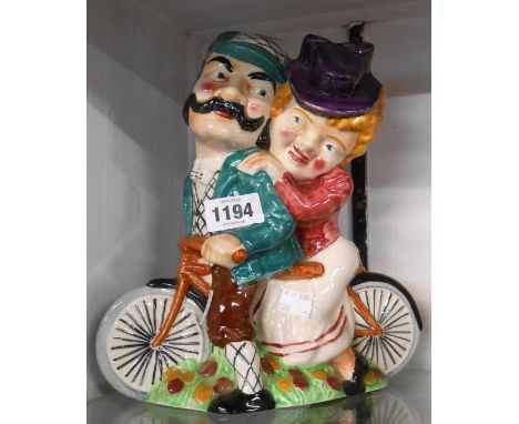 A large Shorter &amp; Sons pottery Daisy Bell figural flower holder depicting a stylised couple riding a bicycle