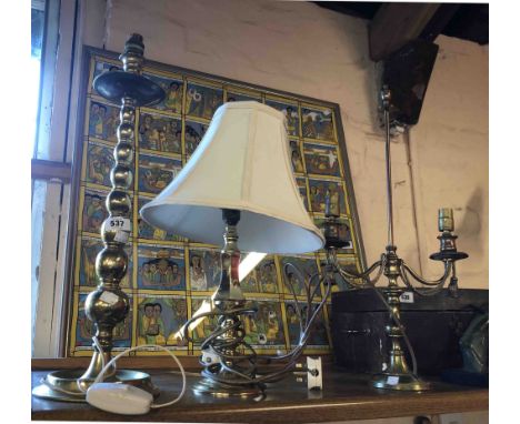 A large brass table lamp of candlestick form with bobbin twist style stem, a modern cast brass BHS table lamp and a brass tab