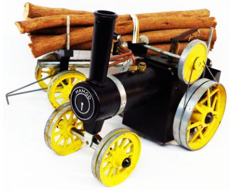 A Mamod live steam traction engine and log trailer