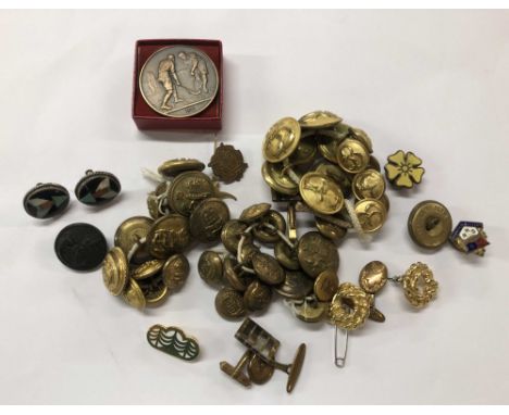 A bag containing a quantity of military and other buttons, enamel badges, pair of micro-mosaic earrings, etc.