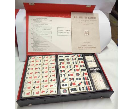 A Japanese mahjong set with instruction book in original vinyl case