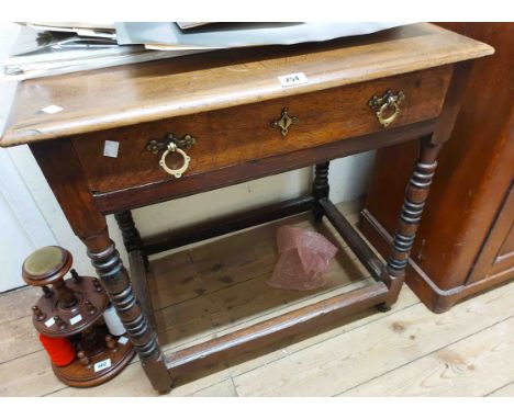 A 72cm Victorian oak side table with Gothic style brass drop-handles to frieze drawer, set on an open stretcher base with bob