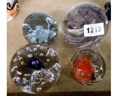 An Isle of White glass paperweight with internal enamel decoration, a Liskeard glass paperweight with controlled bubble decor