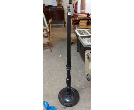 A 20th Century stained wood standard lamp with turned and reeded pillar, set on a moulded circular base