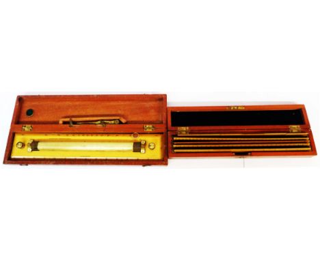 A 19th Century boxwood and brass roller rule marked for W. H. Harling Ltd., 117 Moorgate, London contained in original wooden