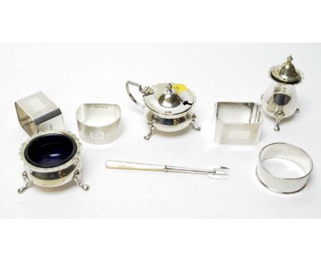 A selection of silver napkin rings, including: pair of silver napkin rings by Walker &amp; Hall, Sheffield 1930; silver napki