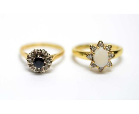 A diamond and sapphire cluster ring, in 18ct yellow gold shank and mount, ring size O, 3.8g gross; and a dress ring.