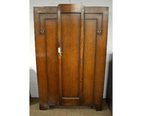 An Art Deco carved oak wardrobe, fitted with central panel door, 115cms wide, 40cms deep, 186cms high; together with a smalle