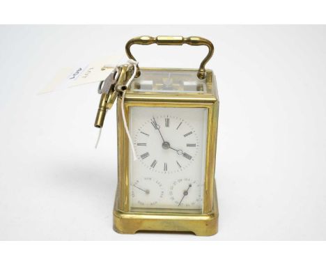 A 19th Century French brass cased carriage clock, with two subsidiary dial with key, 14cms high including handle.