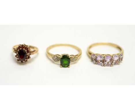 A kunzite and diamond ring; a garnet cluster ring; and a green stone and diamond ring, on 9ct yellow gold shanks, 7.1g gross.