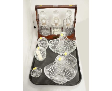 A Balvenie Single Malt Scotch Whisky tantalus, 34cms wide, fitted with three cut glass decanters and stoppers, each with silv