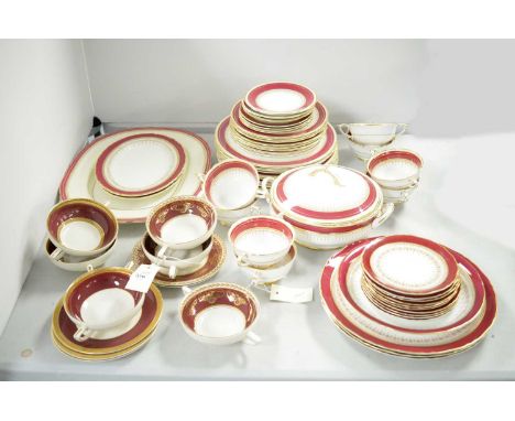 A composite suite of red and gilt decorated dinnerware, including: Paragon "Athene" part dinner service; Royal Worcester "Reg