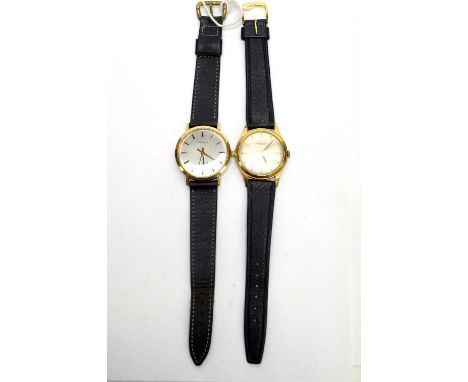 Longines Conquest: a gilt cased wristwatch, fitted manual wind movement, presentation inscription to reverse; and Thomas Russ
