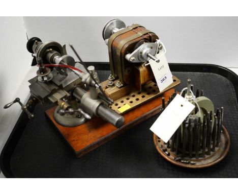 A German 'The Triumph Lathe' watch or clock makers lathe, by Lorch, Schmidt &amp; Co, brass bound, on a mahogany base; togeth
