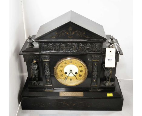 A Victorian slate mantel clock, the case with central gilt metal chapter ring, flanked by soldier supports and classical frie
