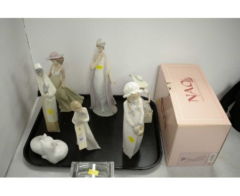 A selection of ceramic figures, including: a Royal Doulton 'Sleepy Heads' cat figure group, HN3894; a Lladro figure of a lady