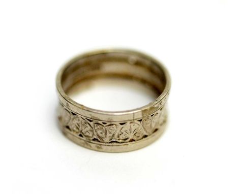 A platinum wedding band, with leaf decoration, ring size N, 6.4g. 