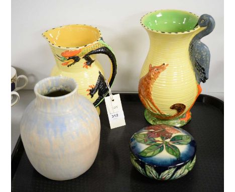 A Moorcroft dish and cover, tubelined with flowers, 13cms diameter; two Art Deco Burleigh Ware water jugs, comprising one wit