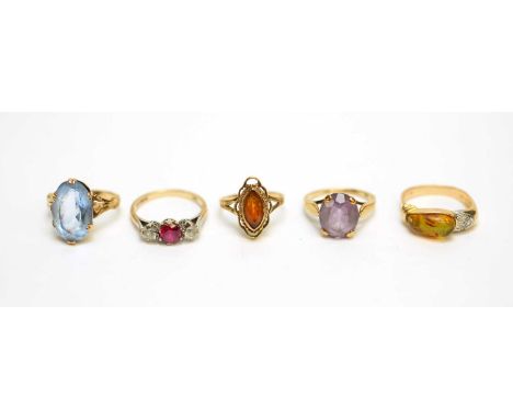 An amber and diamond dress ring, on 14ct yellow gold shank, ring size N; and four other gem set rings, 14.9g gross. 