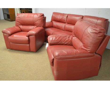 A DFS red leather three-piece suite, comprising: two electric reclining armchairs, 90 x 97 x 98cms high, and a three-seater s