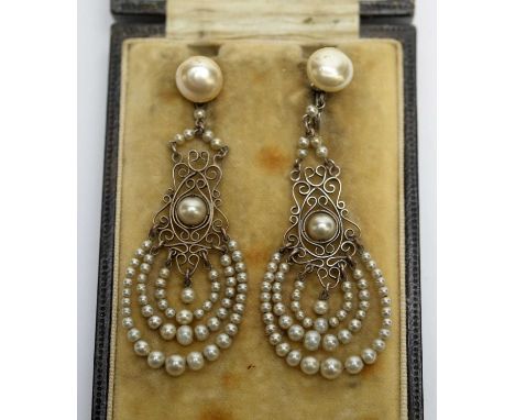 A pair of first half 20th Century French faux-pearl and white metal drop earrings, 5.6cms high, in box marked Luro.