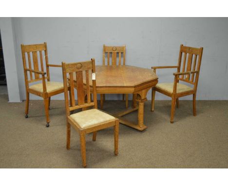 An early 20th Century light oak octagonal centre table, with moulded edge, on fluted column legs with X-stretcher, 118 x 72cm