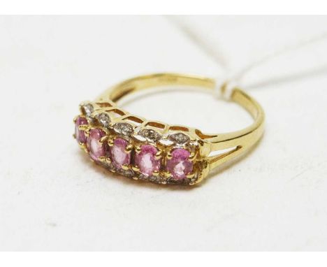 A pink sapphire and diamond ring, the five oval facet cut pink sapphires set with diamonds above and below, on 9ct yellow gol