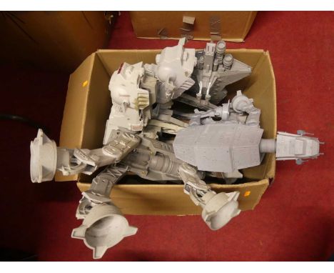 A box containing loose plastic various scales Star Wars AT-AT examples