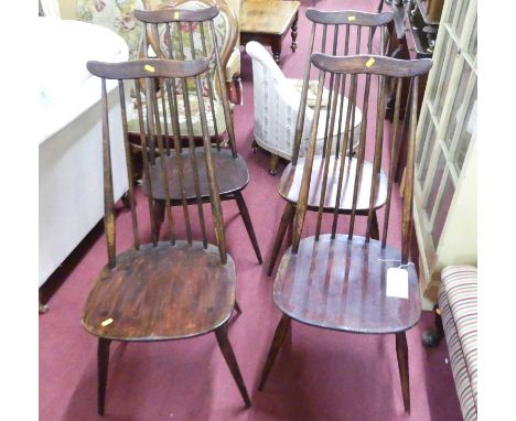 A set of four Ercol elm seat and beech stickback dining chairs
