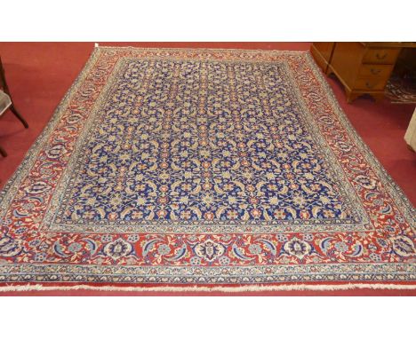 A large Persian woollen blue and red ground Mahal rug, 380 x 292cm