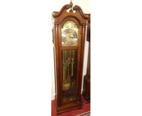 A contemporary mahogany long case clock by Colonial, having arched brass and silvered moon phase dial, with subsidiary second