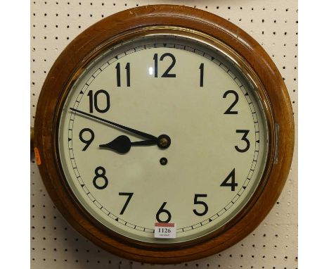 An oak circular wall clock, having plain white enamel dial, single winding hole, fusee movement, with pendulum and winding ke