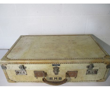 A vintage French suitcase marked with the initials R.M.B. Maker. Also noted H Pignon - Sellier. Au Voyageur,    12 Rue Trenca