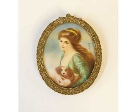 A miniature portrait of a young lady with King Charles spaniel, indistinct signature