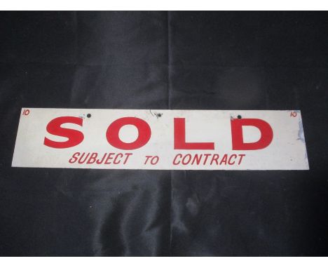 A vintage estate agents metal "Sold" sign, with "Reserved" to reverse.