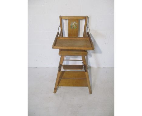 A vintage wooden metamorphic child's high chair